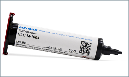 Dymax HLC-M-1004 adhesive is displayed in a Fishman 30cc syringe.